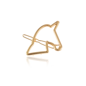 Minimalist golden alloy unicorn hair clip with polished finish on a white background