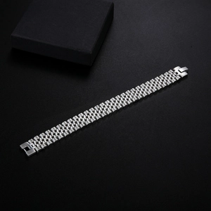 Macro view of silver stainless steel watch strap with polished five-link chain design