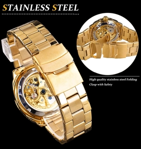 Detail of golden stainless steel folding clasp with safety for automatic skeleton watch