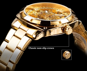 Close-up of the gold-tone classic non-slip crown on an automatic skeleton mechanical watch