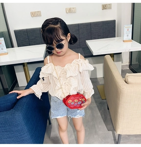 Kids fashion set with a red glitter lip shaped crossbody bag and ruffle sleeve top