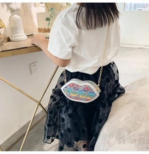 Kid's silver lip-shaped crossbody bag with colorful glitter and gold chain strap