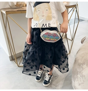 Kids colorful sequin lip shaped crossbody bag shown with a stylish fashion outfit