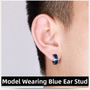 Close-up of a man wearing a blue polished stainless steel hoop ear clip earring