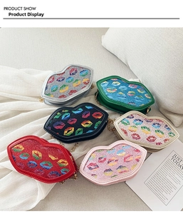 Detail view of colorful glitter lip-shaped mini bags with gold chain straps in six colors
