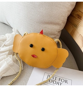 Detailed view of a yellow chick cartoon crossbody bag made of PU leather with gold strap