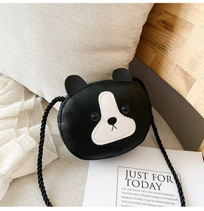 Close-up of black and white animal-shaped mini crossbody bag in textured PU leather