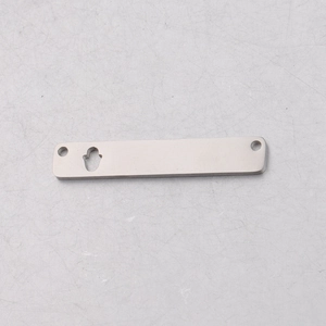Macro shot of silver stainless steel Hamsa hand cutout rectangular DIY jewelry charm