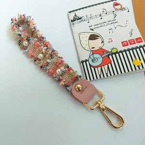 Pink tweed wristlet strap with white pearls and golden metal clip for handbags