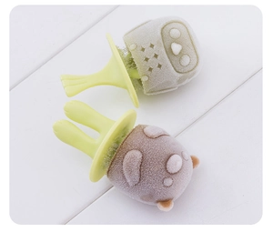 Macro shot of owl and bear shaped homemade popsicles made with silicone ice molds