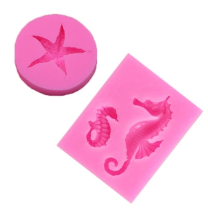 Detailed macro view of pink silicone molds featuring starfish and seahorse patterns