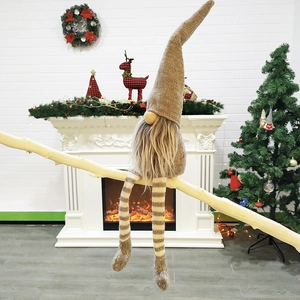 Charming Christmas gnome sitting on a branch with fireplace and festive background