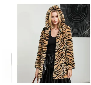 Detailed view of winter tiger print faux fur coat with thick hood and textured material