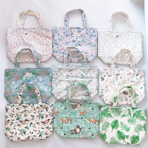 Nine-grid display showing various floral and animal prints on cotton canvas tote bags