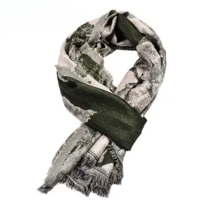 Detail of dark green and beige jacquard pattern scarf with soft fringe trim