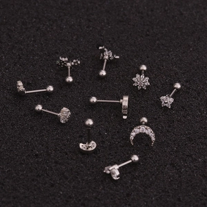 Set of silver stainless steel stud earrings with cubic zirconia in star and flower shapes