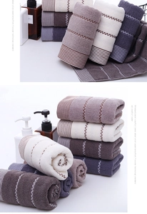 Macro detail of thick cotton towels with water ripple patterns and soft fiber texture