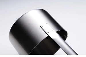 Close-up of stainless steel funnel handle with four sturdy rivets and brushed texture