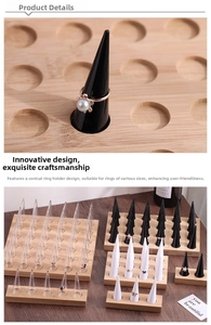 Close-up of conical ring display holders on a round wooden base in multiple colors