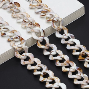 Retro resin acrylic eyewear chain with tortoise marble texture on white books