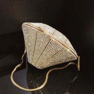 Diamond shaped crystal clutch bag with champagne gold rhinestones and a metal chain strap