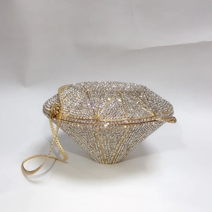 Detailed close-up of diamond-shaped clutch bag with sparkling rhinestone encrustation
