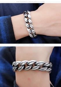 Detail of masculine vintage stainless steel Cuban link bracelet with antique silver finish