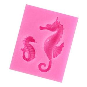 Detailed view of pink silicone mold featuring two different seahorse shaped cavities