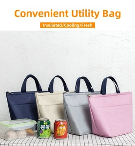 Waterproof insulated lunch bags in four colors displayed on a checkered table