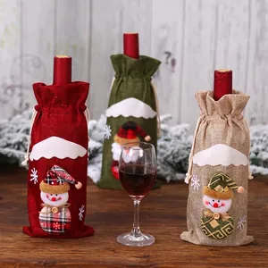 Three Christmas burlap wine bottle covers with 3D snowman designs and drawstring closure