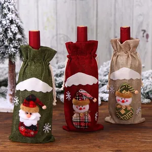 Three-piece burlap Christmas wine bottle covers with Santa and snowman patterns
