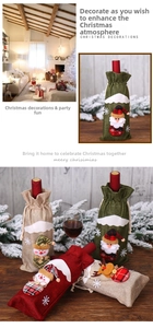 Detailed view of linen Christmas wine bottle covers with 3D Santa and reindeer designs