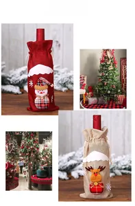 Detail of Christmas wine bags with plaid reindeer and snowman embroidery on burlap fabric