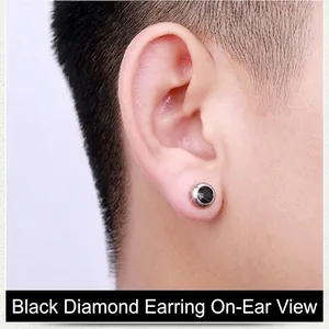 Unisex stainless steel stud earrings with black round-cut cubic zirconia on ear lobe