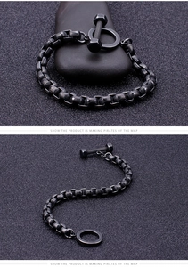 Detailed close-up of black industrial chain bracelet featuring dumbbell OT clasp design
