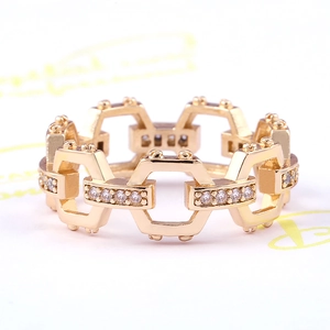 Macro detail of rose gold geometric hexagon ring with pave-set white cubic zirconia stones