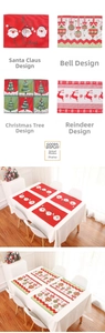 Detail of Christmas table mats featuring Santa, Reindeer, and Tree embroidery designs