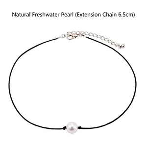 Detail of single freshwater pearl choker with black cord and 6.5cm silver extension chain