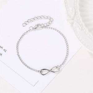 Detail view of silver infinity charm bracelet with lobster clasp and adjustable chain