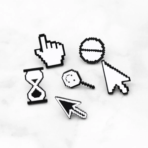 Macro detail of classic pixel-style enamel pins showing cursor and loading symbols