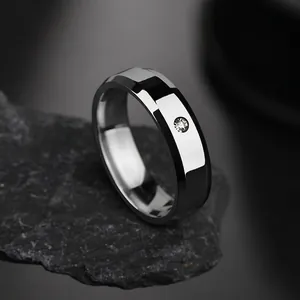 Detailed macro view of 8mm silver stainless steel ring with center-set diamond on rock