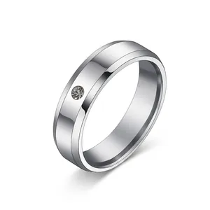 Polished 8mm stainless steel band ring with single diamond inlay for men and women