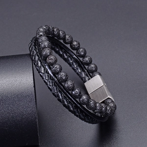 Men's multilayer bracelet with black lava stone beads, braided leather, and magnetic clasp