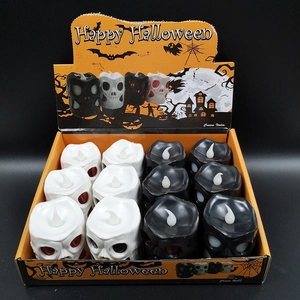 12-pack Halloween LED skull candle lights in black and white decorative display box