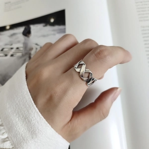 Minimalist 925 sterling silver vintage twisted ring shown in a stylish hand-worn view