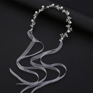 Elegant silver bridal headband with alloy leaves, pearls and rhinestones on black stand
