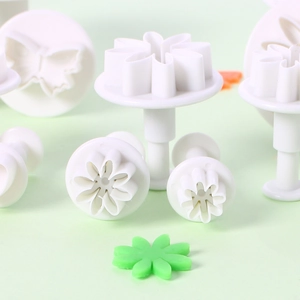 Detailed set of white floral and butterfly fondant stamps for cake decorating and baking