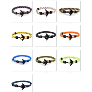 Collection of ten braided anchor bracelets in various colors with black matte buckles