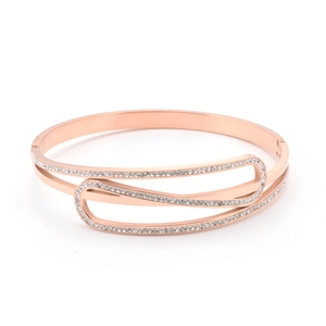Macro detail of rose gold titanium steel bracelet with layered geometric diamond setting