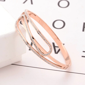 Rose gold layered titanium steel bracelet with diamonds and geometric design